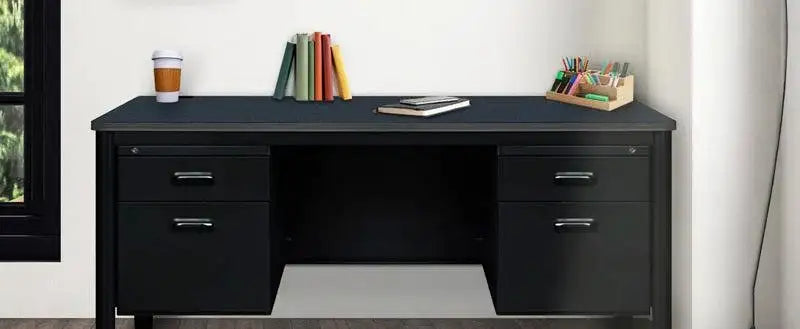 Black double-pedestal office desk with a dark top, four drawers, and a center kneehole, styled with books and a coffee cup by a window