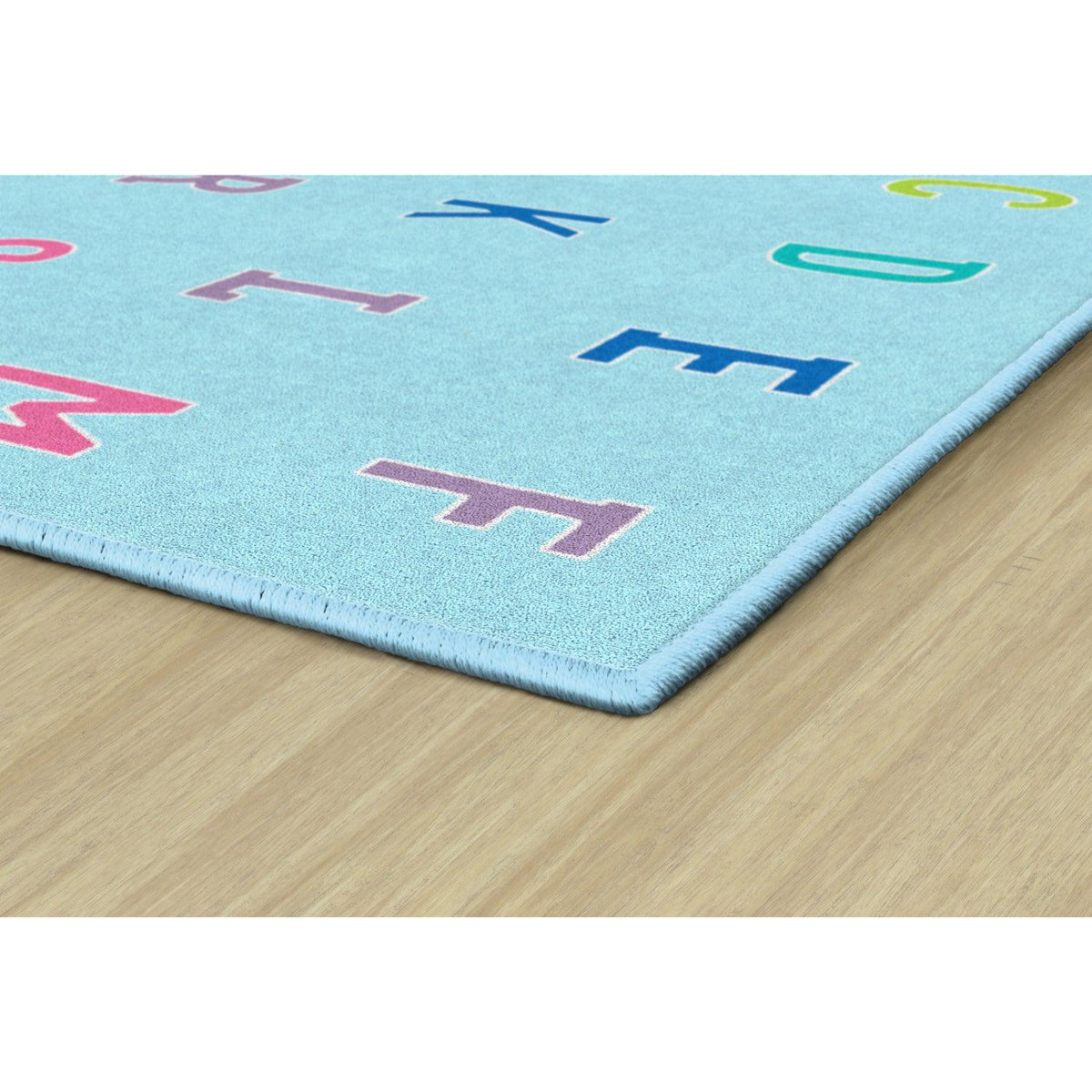 Schoolgirl Style Alphabet On Blue Criss Cross Rugs